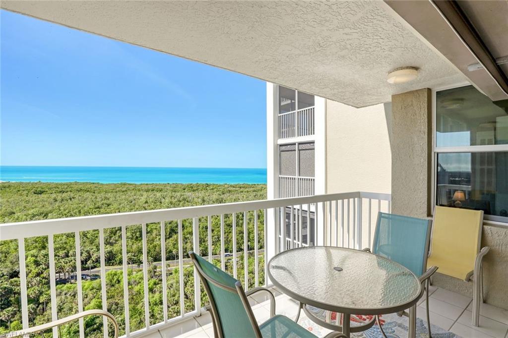 6573 Marissa Loop, Unit 1902 Naples, FL 34108 - Photo 14 of 21 a view of a balcony with chairs