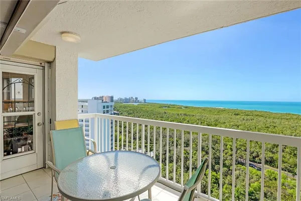 a view of a balcony with chairs