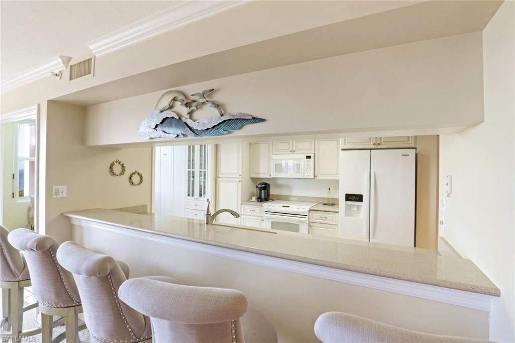 6573 Marissa Loop, Unit 1902 Naples, FL 34108 - Photo 3 of 21 a dining room with furniture and window