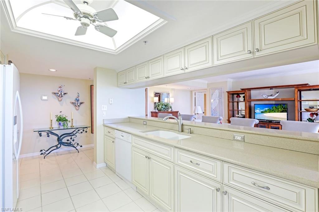 6573 Marissa Loop, Unit 1902 Naples, FL 34108 - Photo 21 of 21 a spacious en suite bathroom with a granite countertop sink and a mirror