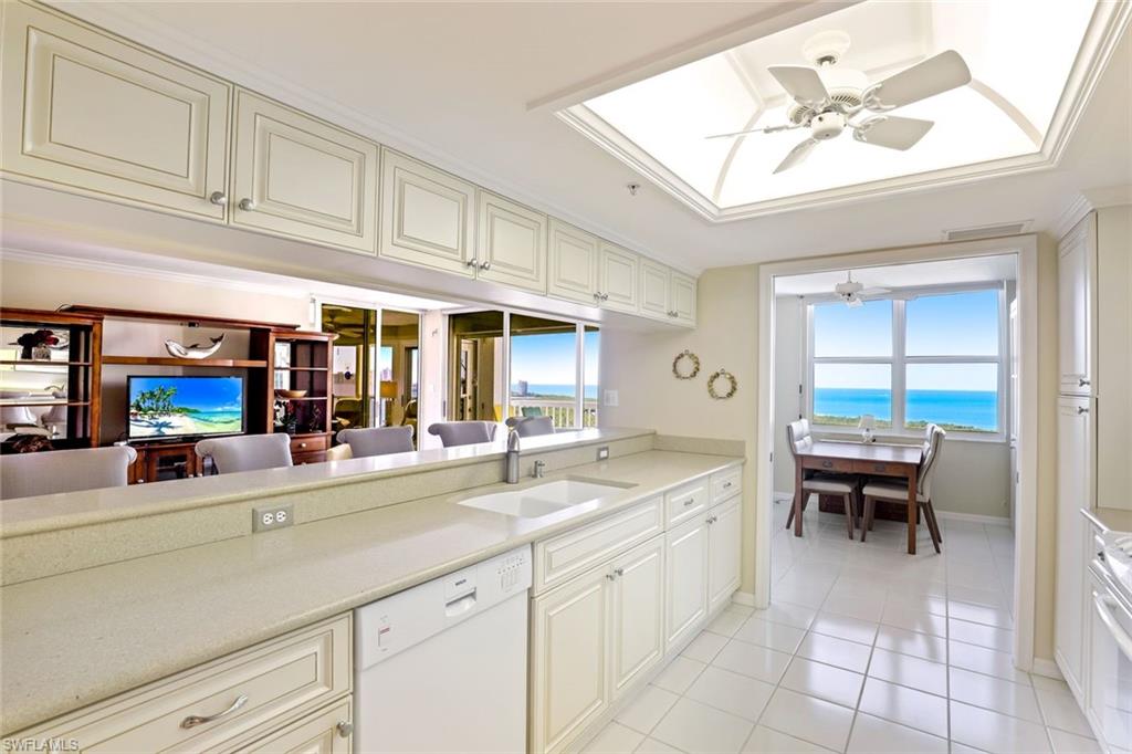 6573 Marissa Loop, Unit 1902 Naples, FL 34108 - Photo 4 of 21 a kitchen with cabinets and window
