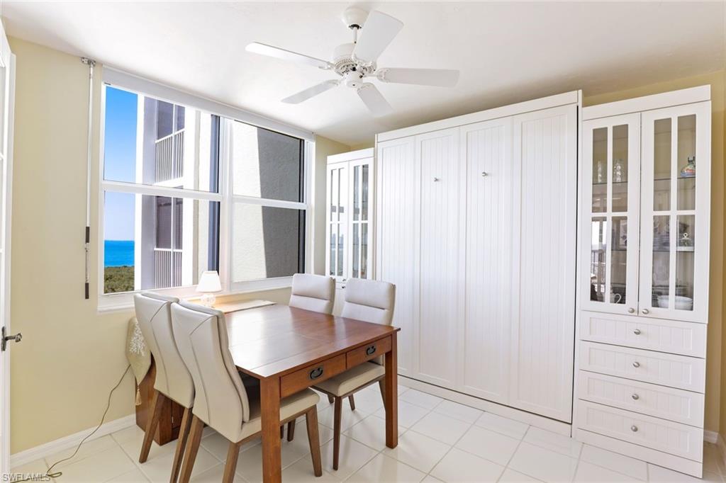 6573 Marissa Loop, Unit 1902 Naples, FL 34108 - Photo 6 of 21 a view of a dining room with furniture and window