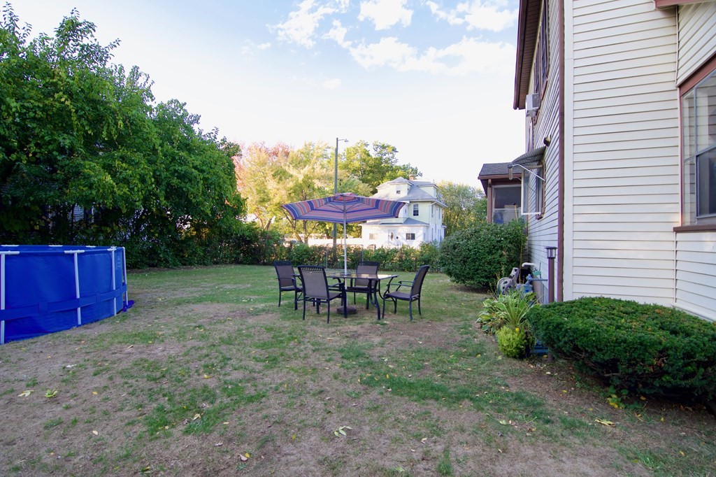 244 Allen Street Springfield, MA 01108 - Photo 5 of 42 a view of a chairs in a backyard