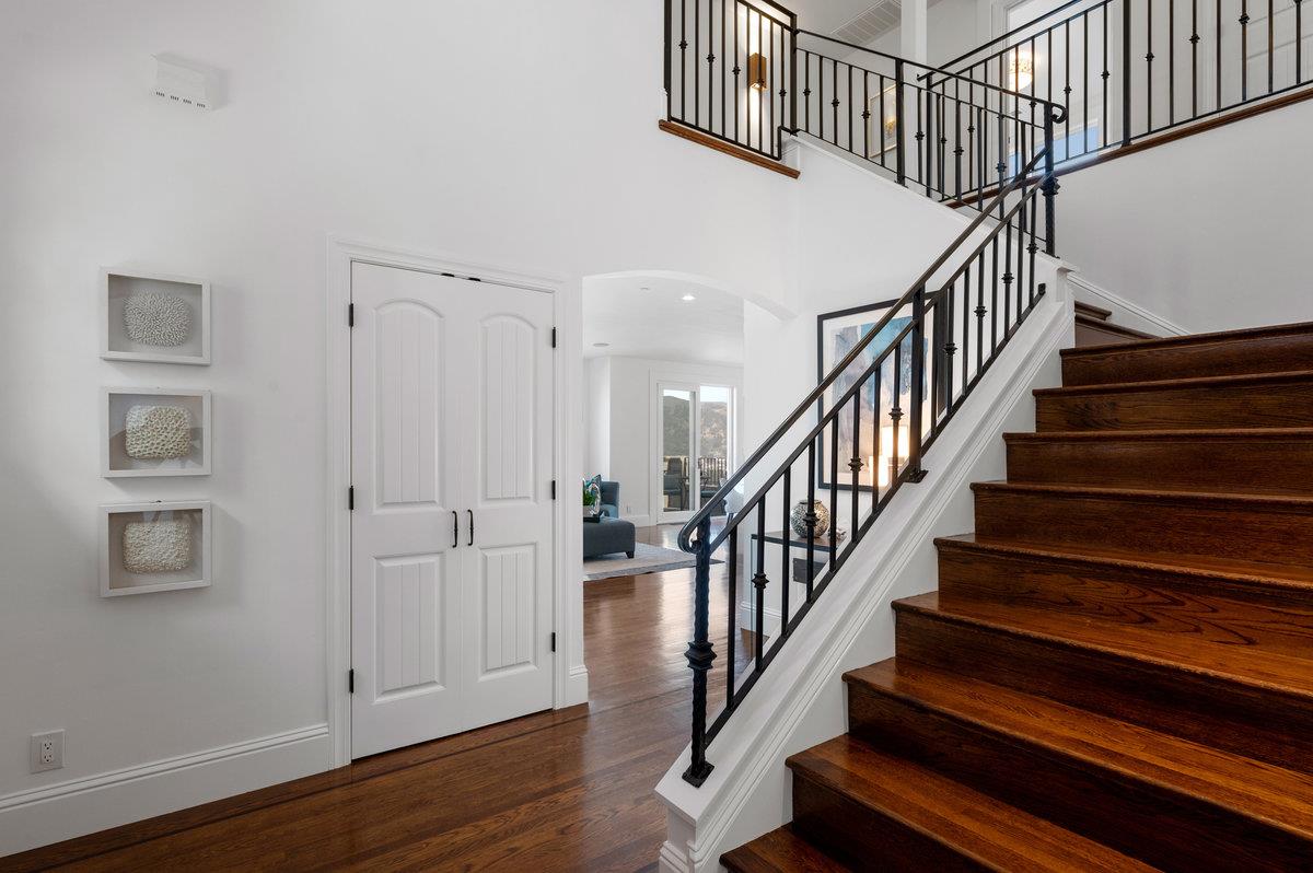 240 Stanley Avenue Pacifica, CA 94044 - Photo 34 of 100 a view of staircase with wooden floor and white walls