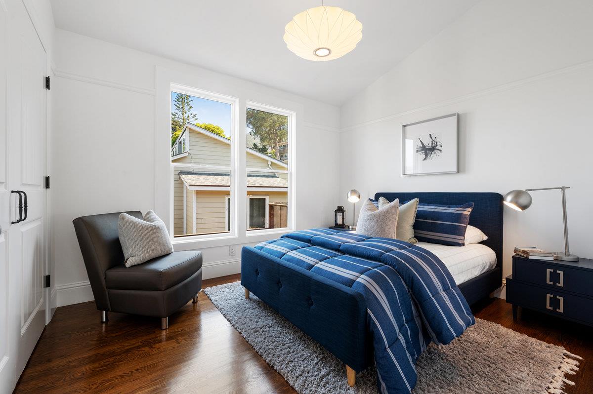 240 Stanley Avenue Pacifica, CA 94044 - Photo 49 of 100 a bedroom with a bed and wooden floor