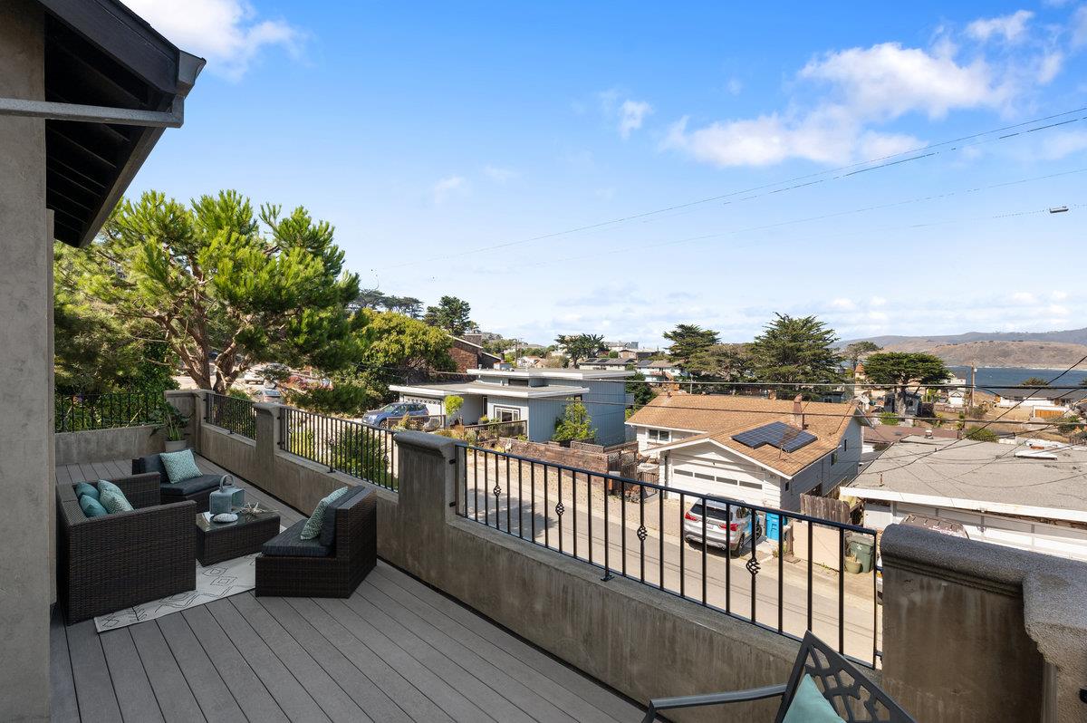 240 Stanley Avenue Pacifica, CA 94044 - Photo 74 of 100 a view of a balcony with wooden chairs