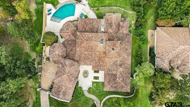 an aerial view of a house with outdoor space