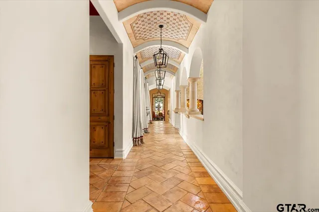 a view of a hallway with windows