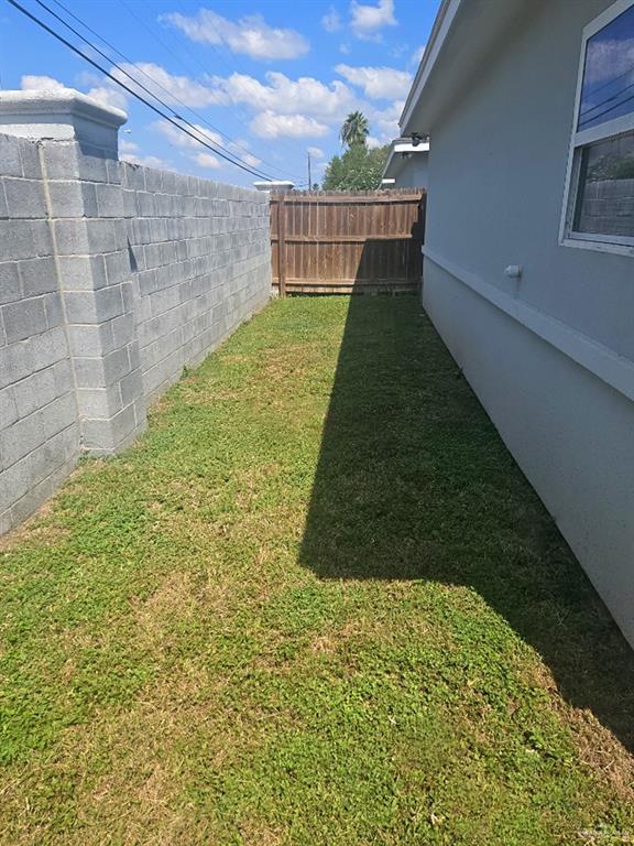 304 Retama Lane, Unit 2 Weslaco, TX 78596 - Photo 7 of 10 a view of outdoor space and yard