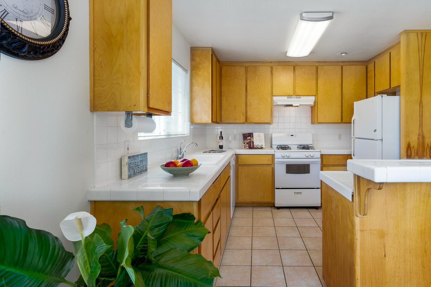 124 Sycamore Street Santa Cruz, CA 95060 - Photo 11 of 40 a kitchen that has a sink and a stove