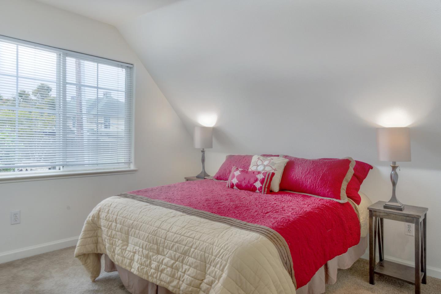 124 Sycamore Street Santa Cruz, CA 95060 - Photo 14 of 40 a bed sitting in a bedroom next to a window