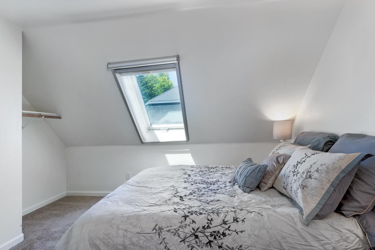 124 Sycamore Street Santa Cruz, CA 95060 - Photo 15 of 40 a bedroom with a bed and a window