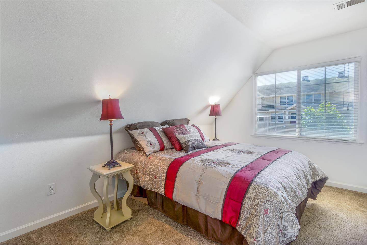 124 Sycamore Street Santa Cruz, CA 95060 - Photo 16 of 40 a bed sitting in a bedroom next to a window
