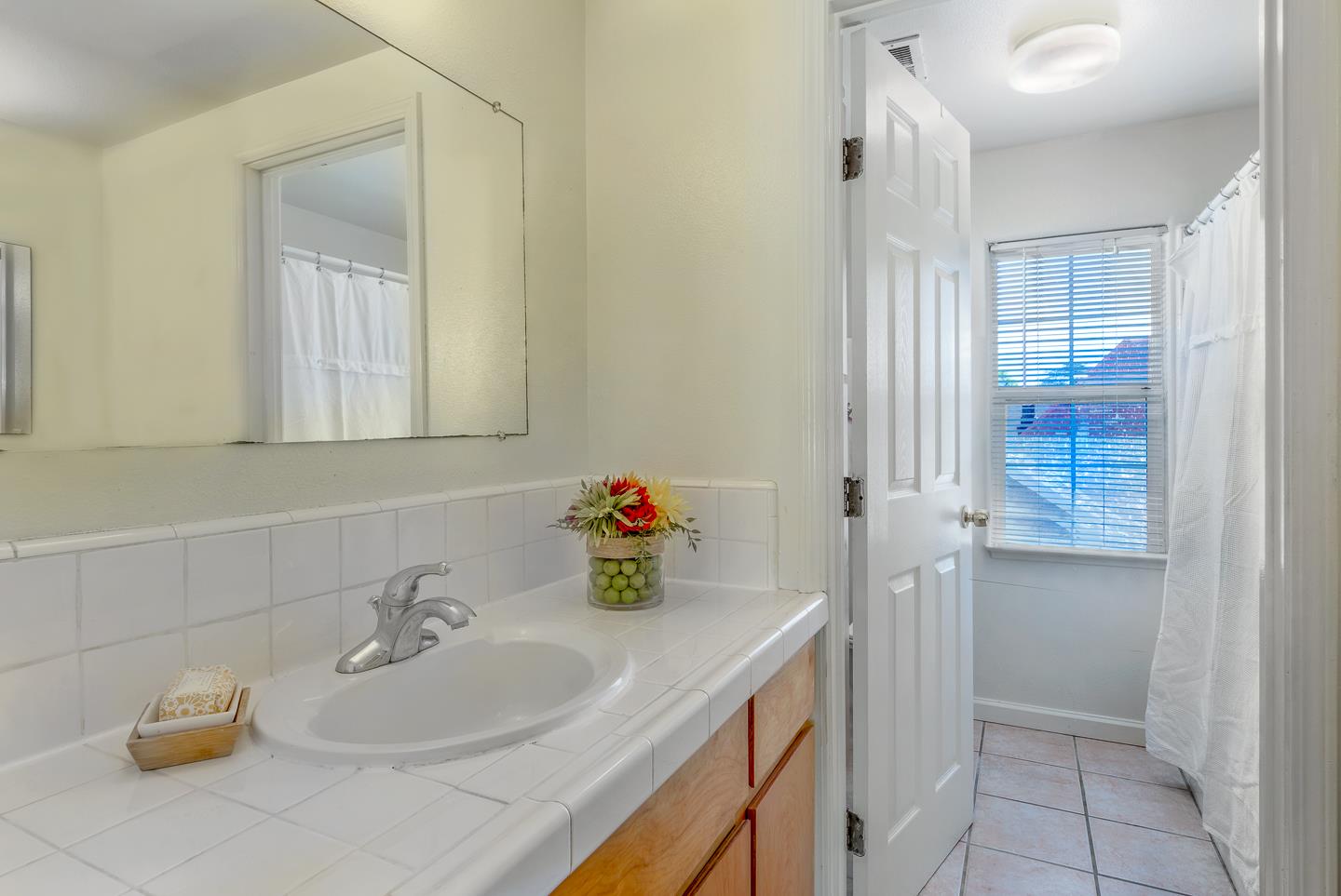 124 Sycamore Street Santa Cruz, CA 95060 - Photo 17 of 40 a bathroom with a sink and a mirror
