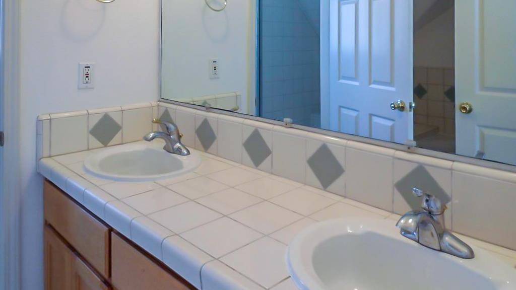 124 Sycamore Street Santa Cruz, CA 95060 - Photo 33 of 40 a bathroom with a sink and a mirror