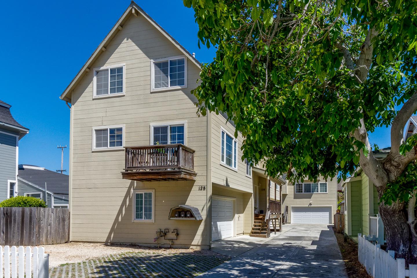 124 Sycamore Street Santa Cruz, CA 95060 - Photo 4 of 40 a view of a brick house with plants and large trees