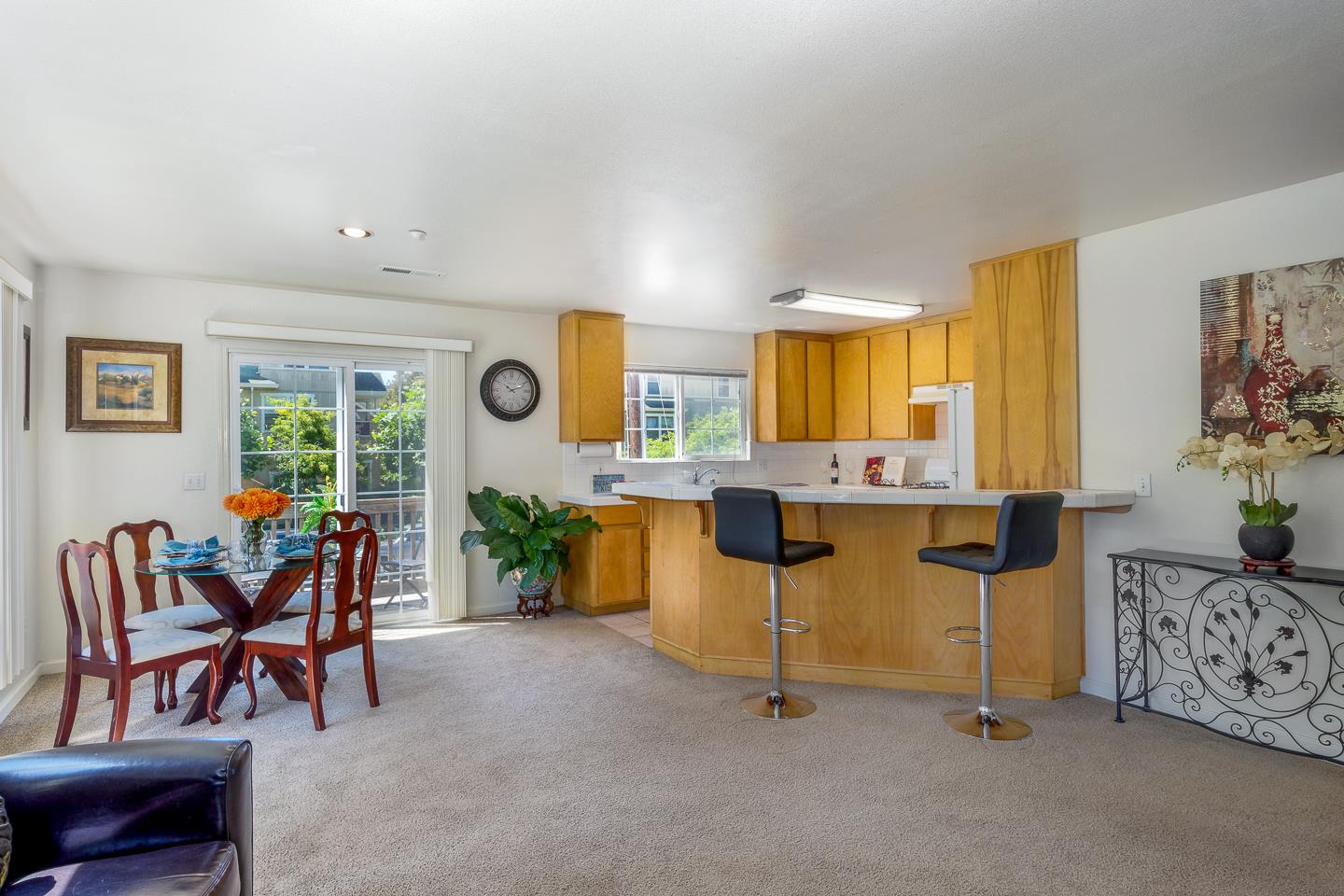 124 Sycamore Street Santa Cruz, CA 95060 - Photo 10 of 40 a living room with furniture and a table