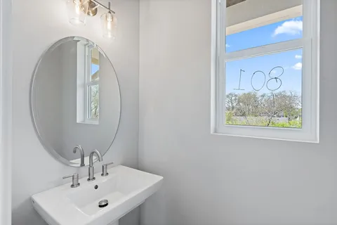 a bathroom with a sink and mirror