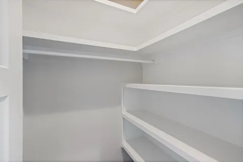a view of an empty walk in closet