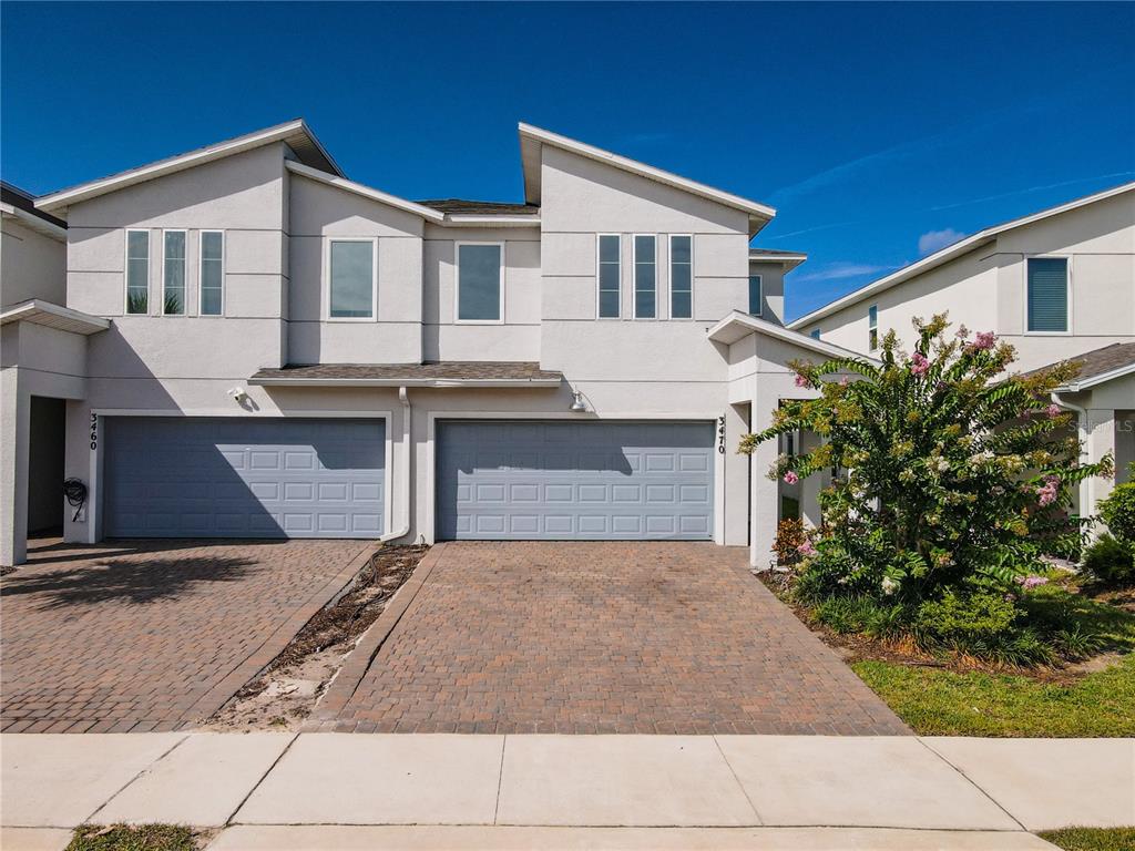a front view of a house with yard