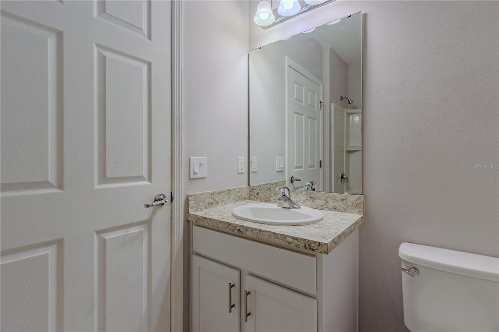 3470 Beau Road Kissimmee, FL 34746 - Photo 12 of 40 a bathroom with a sink and a mirror