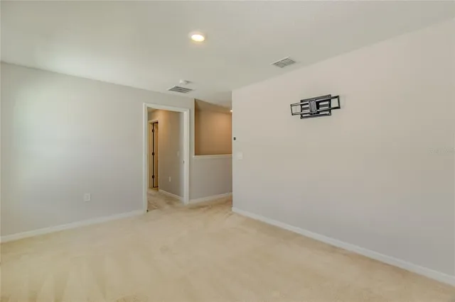 an empty room with a hallway