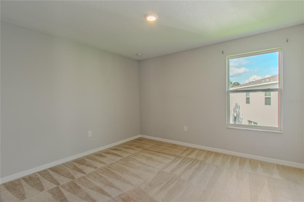 3470 Beau Road Kissimmee, FL 34746 - Photo 17 of 40 an empty room with a window