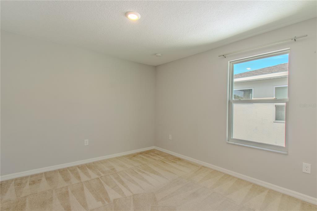 3470 Beau Road Kissimmee, FL 34746 - Photo 18 of 40 an empty room with a window