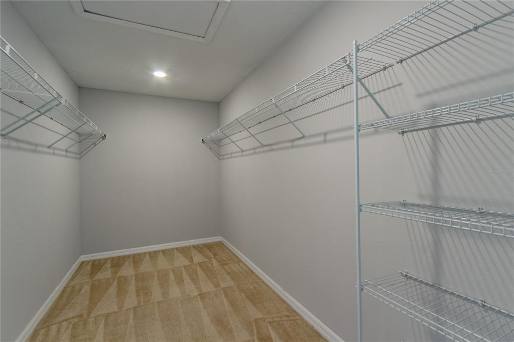 3470 Beau Road Kissimmee, FL 34746 - Photo 21 of 40 a view of a room with racks on the wall