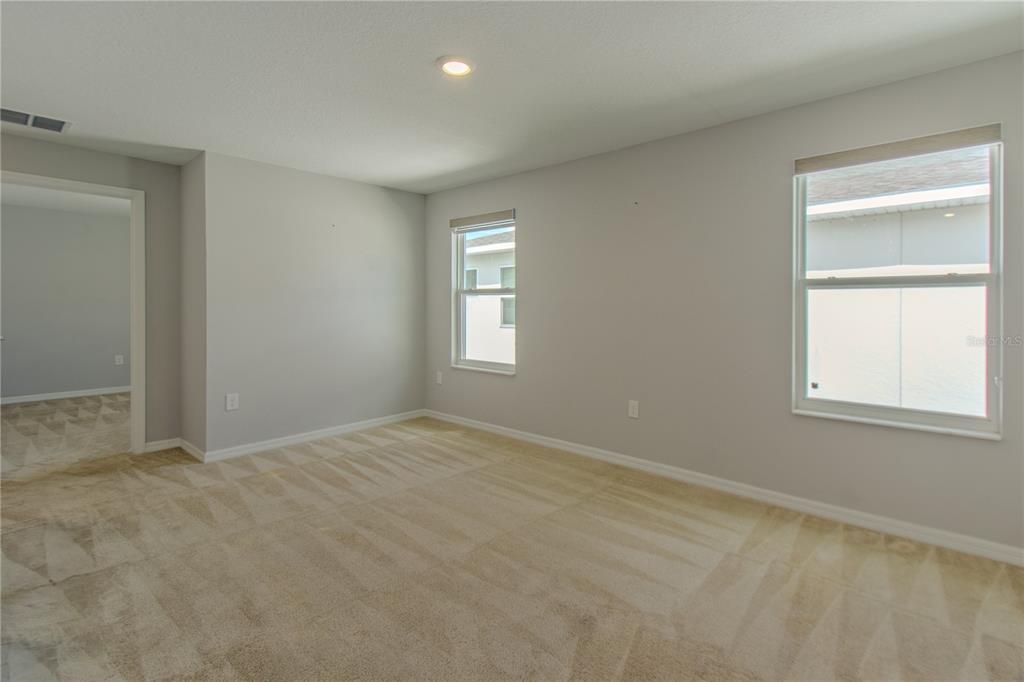 3470 Beau Road Kissimmee, FL 34746 - Photo 26 of 40 an empty room with windows