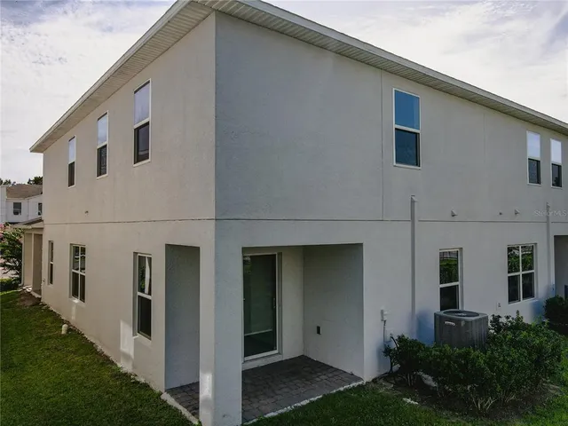 a view of a back yard of the house