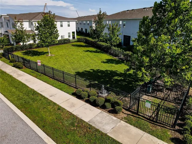 a view of a backyard with sitting area