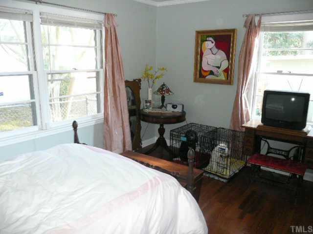 600 Edmund Street Raleigh, NC 27604 - Photo 6 of 12 a bedroom with a bed and furniture