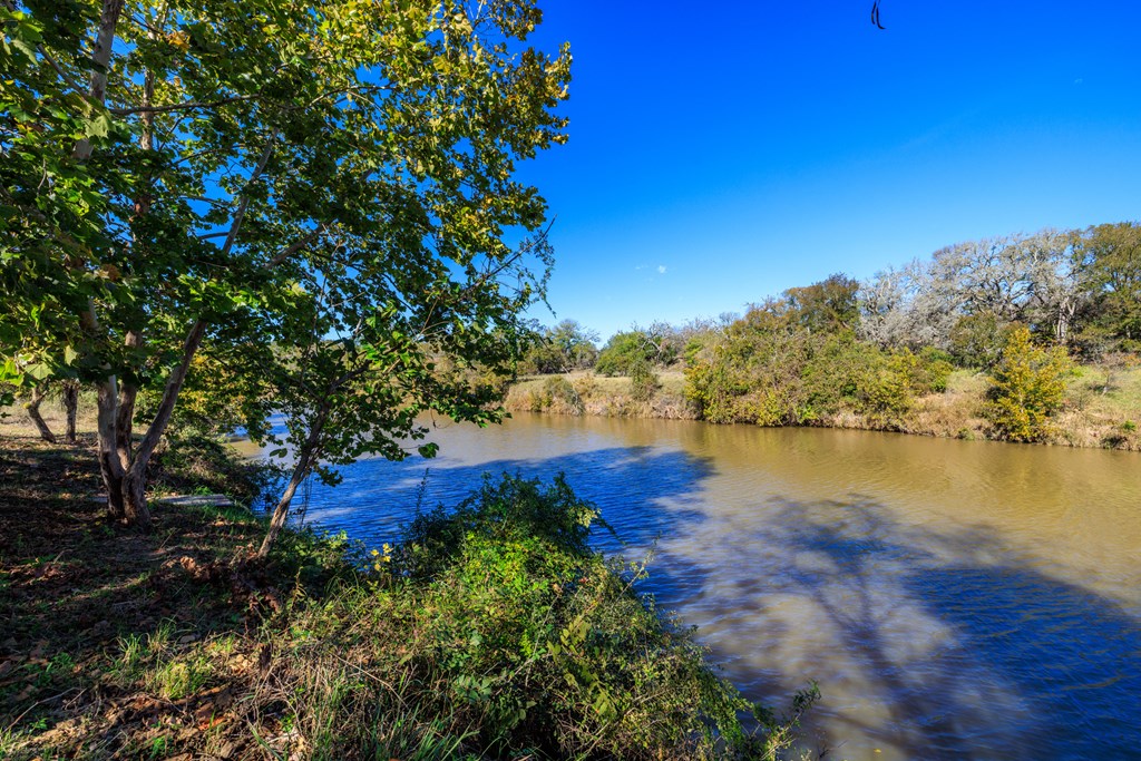 181 Ranch Road 1 Stonewall, TX 78671 - Photo 16 of 18 a view of a lake with houses