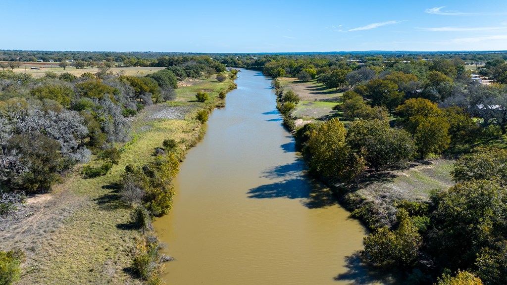 181 Ranch Road 1 Stonewall, TX 78671 - Photo 17 of 18 a view of a lake with beach and outdoor space