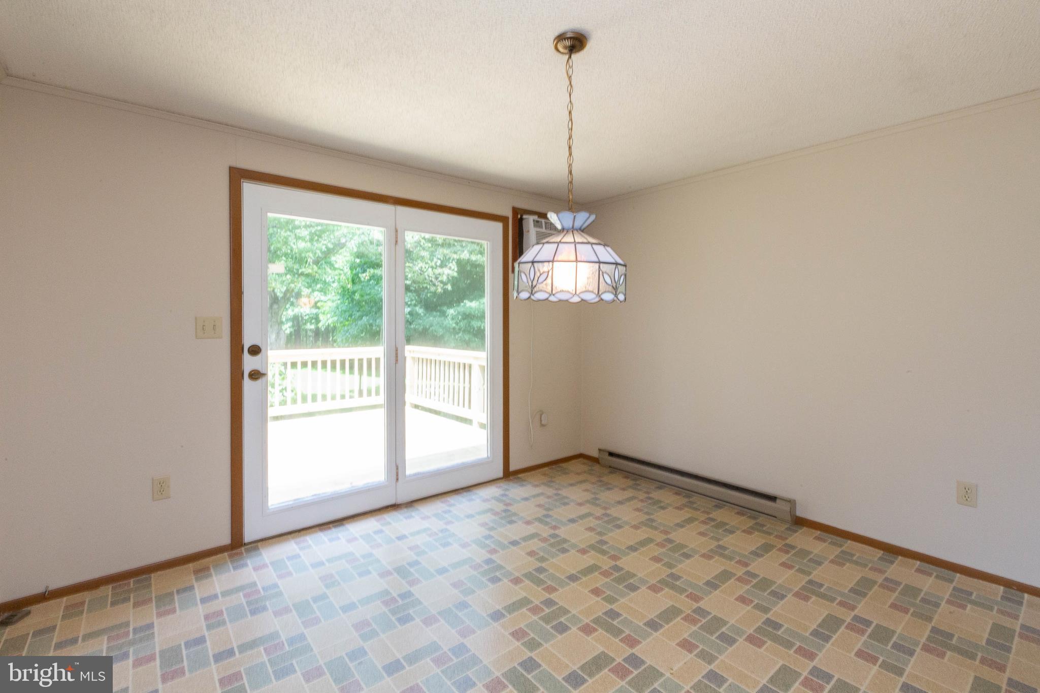 3555 Carrollton Road Upperco, MD 21155 - Photo 12 of 26 BRIGHT BREAKFAST AREA LEADS TO DECK
