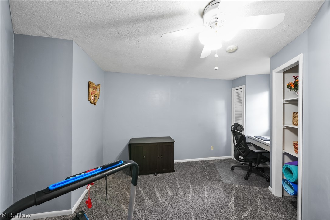 11247 Prospect Road Strongsville, OH 44149 - Photo 38 of 49 Office area featuring a textured ceiling, carpet floors, and ceiling fan