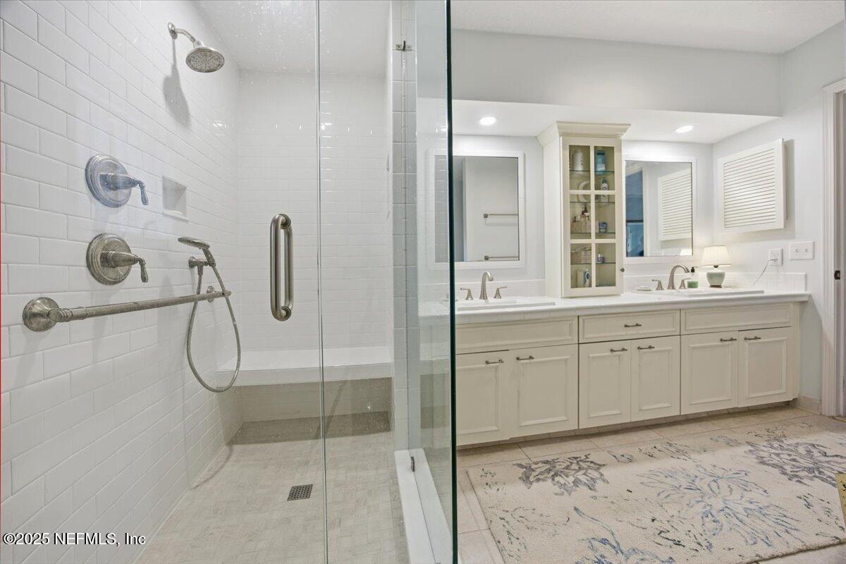 84 Players Club Villas Road Ponte Vedra Beach, FL 32082 - Photo 14 of 20 a spacious bathroom with a shower sink and mirror