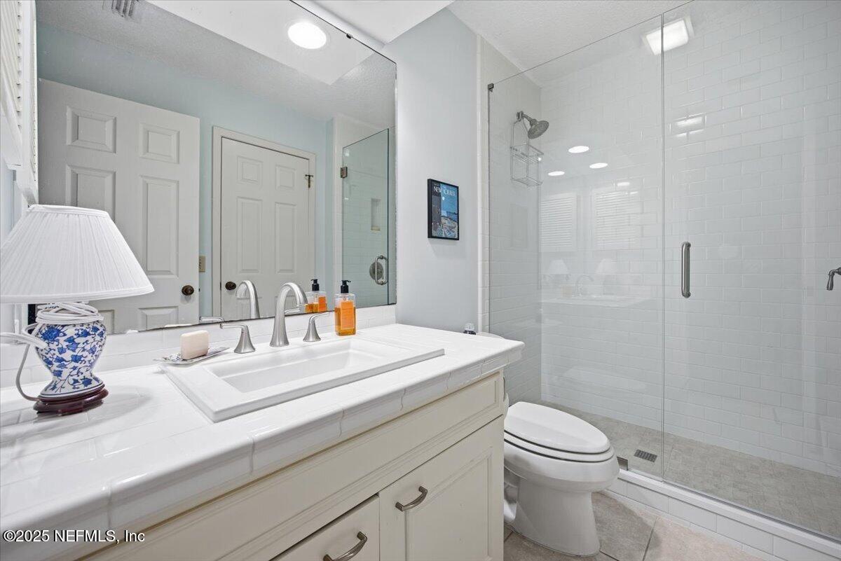 84 Players Club Villas Road Ponte Vedra Beach, FL 32082 - Photo 19 of 20 a bathroom with a sink a toilet and shower