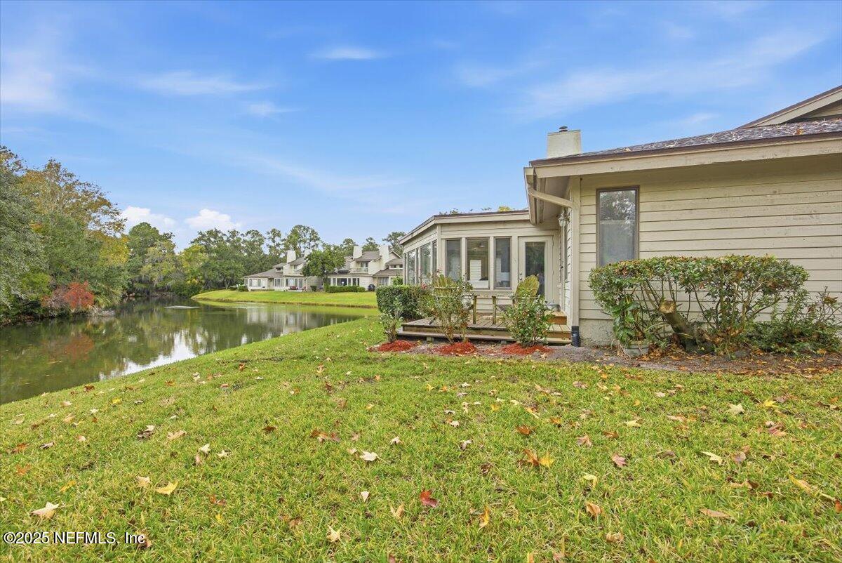 84 Players Club Villas Road Ponte Vedra Beach, FL 32082 - Photo 20 of 20 a view of a house with a yard table and chairs