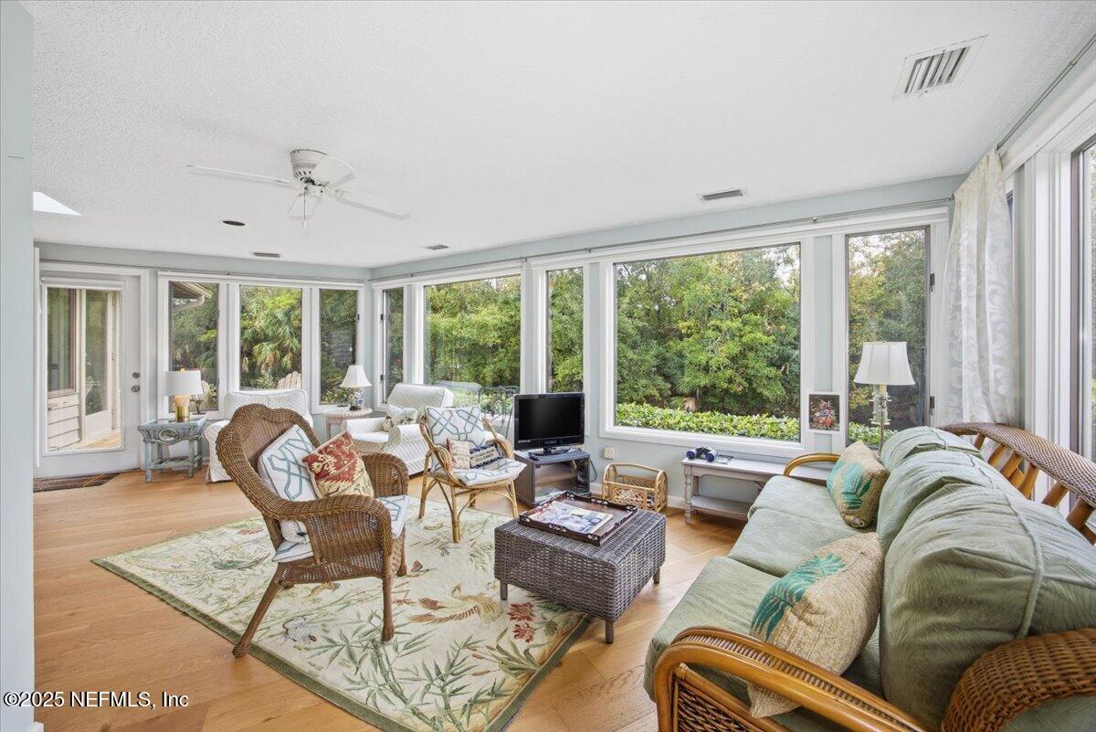 84 Players Club Villas Road Ponte Vedra Beach, FL 32082 - Photo 9 of 20 a living room with furniture and a large window