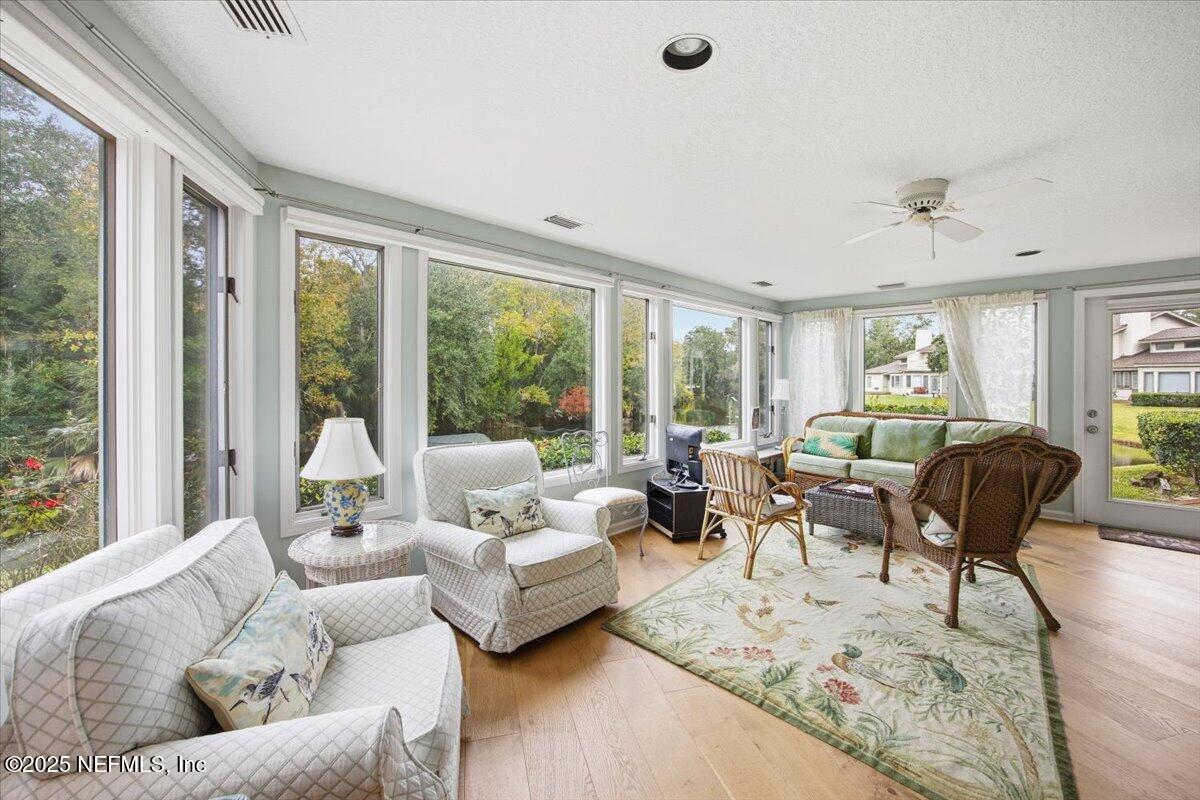 84 Players Club Villas Road Ponte Vedra Beach, FL 32082 - Photo 10 of 20 a living room with furniture and a large window