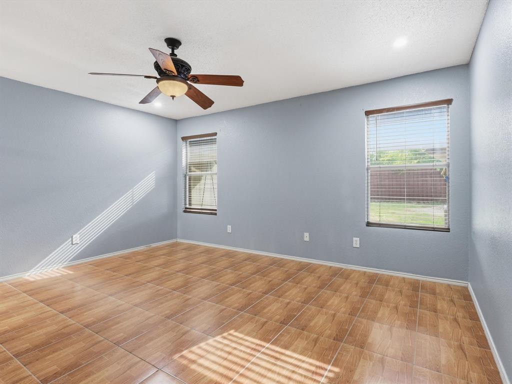 918 Blue Sky Drive Arlington, TX 76002 - Photo 18 of 24 a view of empty room with window and ceiling fan
