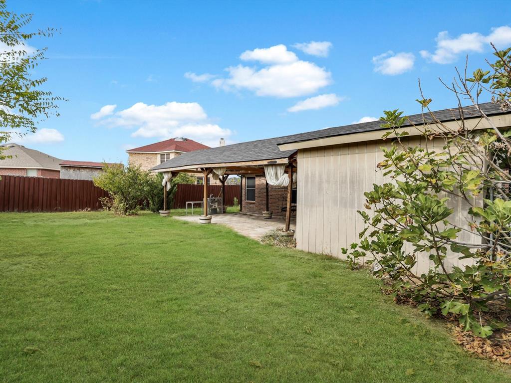 918 Blue Sky Drive Arlington, TX 76002 - Photo 23 of 24 a view of a house with a backyard