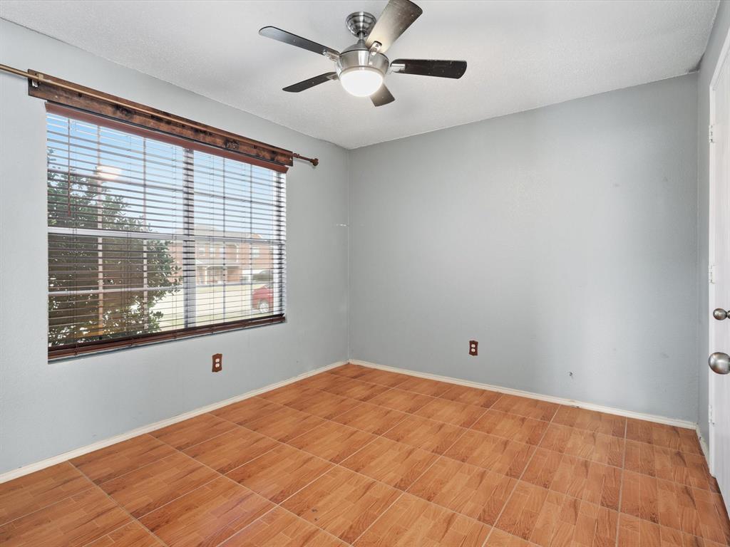 918 Blue Sky Drive Arlington, TX 76002 - Photo 3 of 24 a view of a big room with windows and chandelier fan