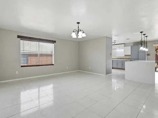 a view of a kitchen with furniture and cabinets