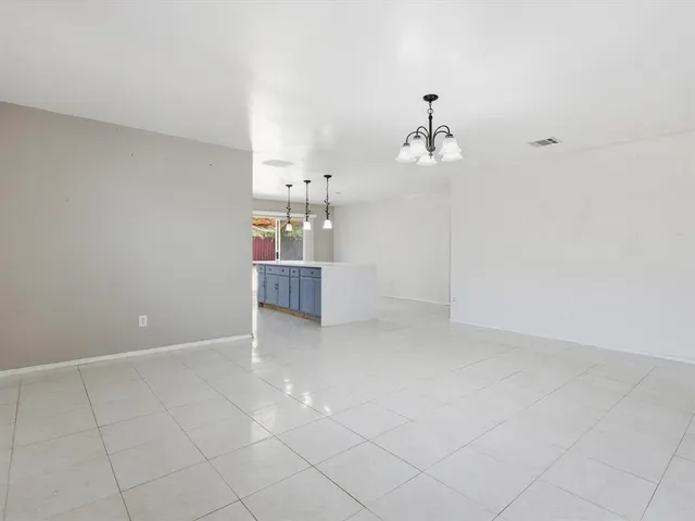 a view of a kitchen with dishwasher and cabinets