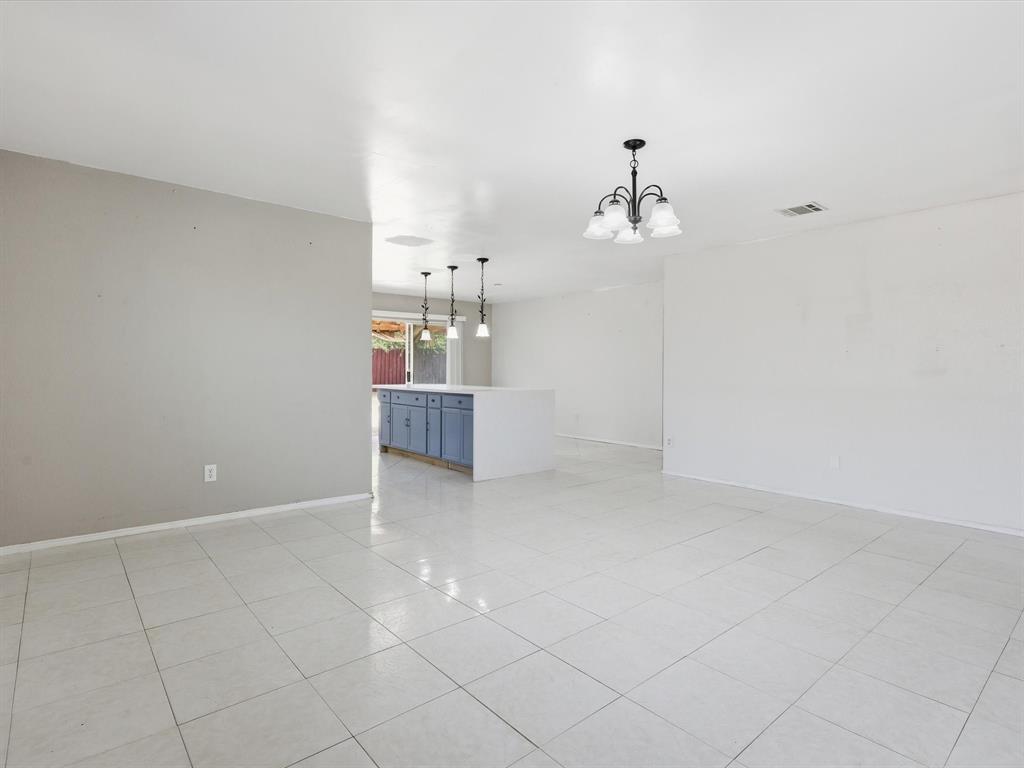 918 Blue Sky Drive Arlington, TX 76002 - Photo 7 of 24 a view of a kitchen with dishwasher and cabinets