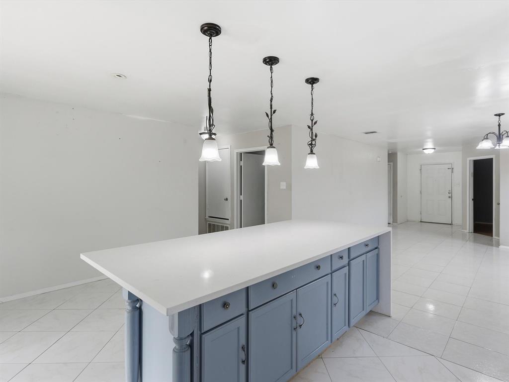 918 Blue Sky Drive Arlington, TX 76002 - Photo 10 of 24 a view of a kitchen with a sink and an empty room