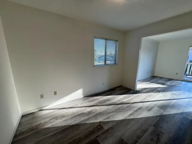 a view of entryway with wooden floor